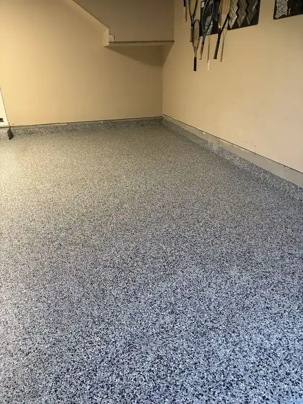After: Corner of a garage with a flake epoxy floor