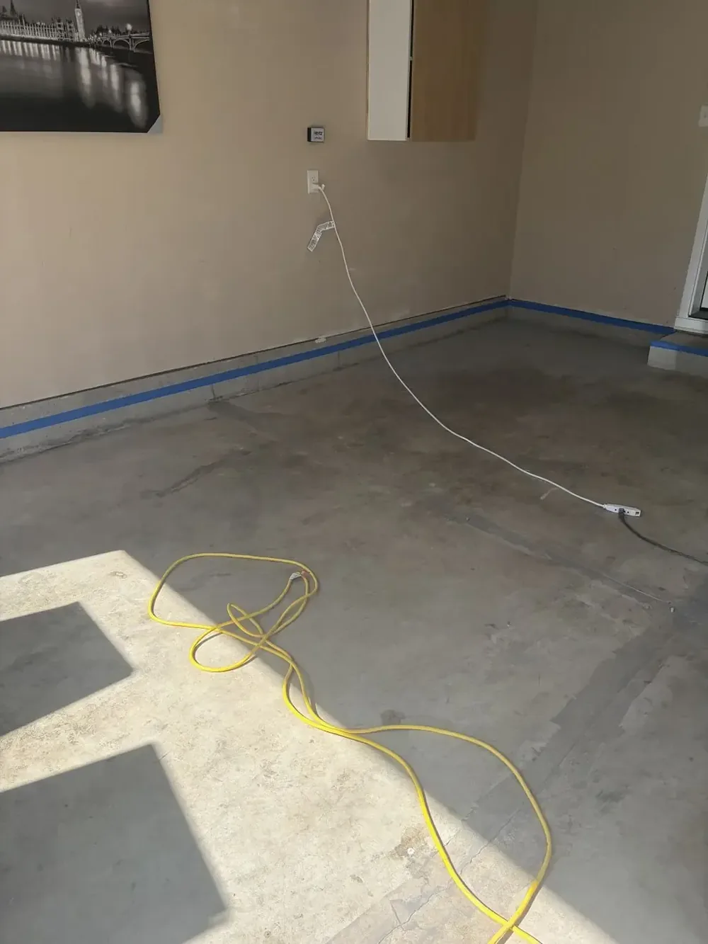 Before: Garage floor prepared for an epoxy coating